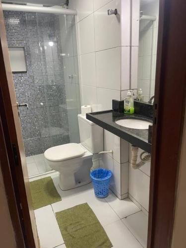 a bathroom with a toilet and a sink and a shower at Flat Manaira, lado do Manaira Shopping in João Pessoa