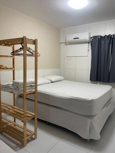 a small room with a bed and a bunk bed at Flat Manaira, lado do Manaira Shopping in João Pessoa