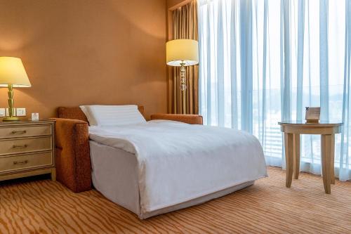 Lova arba lovos apgyvendinimo įstaigoje Similan Hotel Zhuhai-Gongbei Port