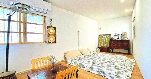 En eller flere senge i et værelse på 沐時光民宿