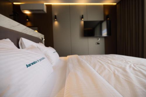 Giường trong phòng chung tại Awwa Boutique Hotel