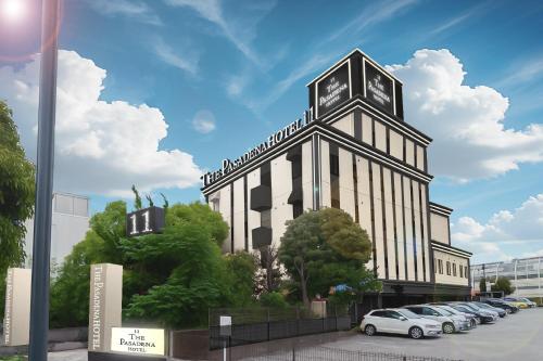 a building with a clock tower on top of it at hotel the pasadena 11 funabashi in Funabashi
