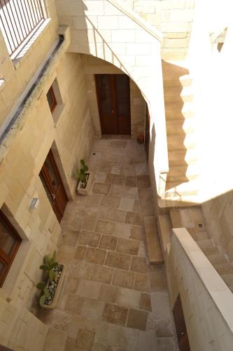 an overhead view of a hallway in a building at Corte Kalìnora in Martano