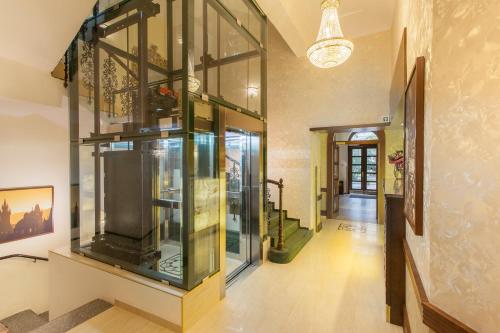a large glass display case in a hallway at Green Garden Hotel in Prague