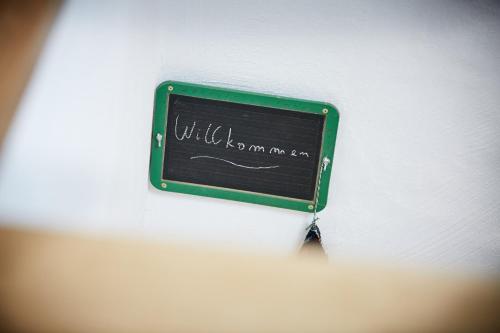 a chalkboard with writing on it on a wall at Basalt-Loft in Kottenheim