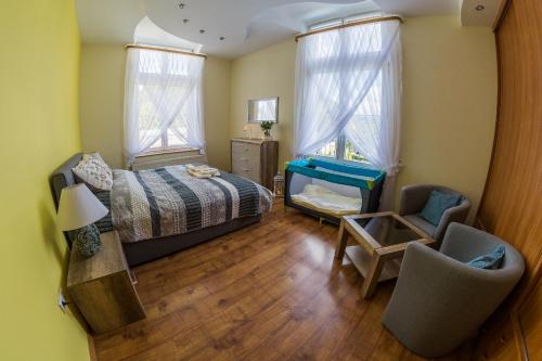 Posteľ alebo postele v izbe v ubytovaní Apartament Zdrojowa 45