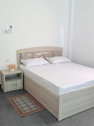 En eller flere senge i et værelse på Sunray Homes