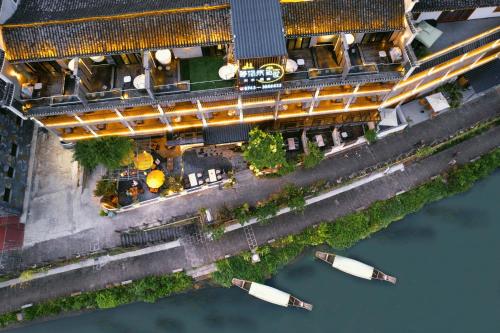 an overhead view of a bridge over the water at Phoenix Ancient Hill Riverside View Hotel- Offers free one-way high-speed rail pick-up service - Afternoon tea - Self-service laundry - Baggage storage - Travel planning in Fenghuang County