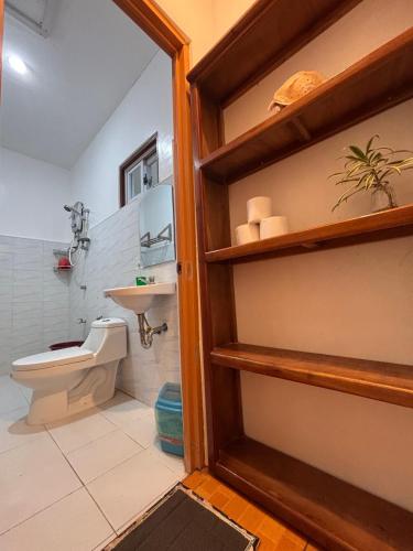 a bathroom with a toilet and a sink at 6227 Guesthouse in San Juan