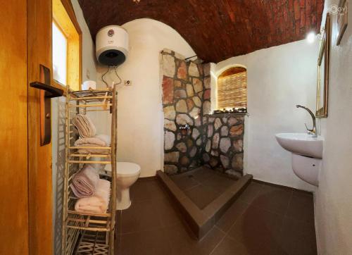 a bathroom with a toilet and a sink at ASSINGAR Island in Aswan