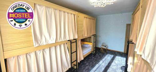 Postel nebo postele na pokoji v ubytování Oneday UB