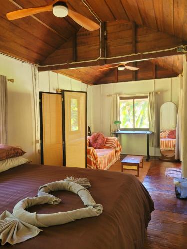 a bedroom with a large bed in a room at LowKey Villa - Quiet Jungle Beach Escape in Ko Kood