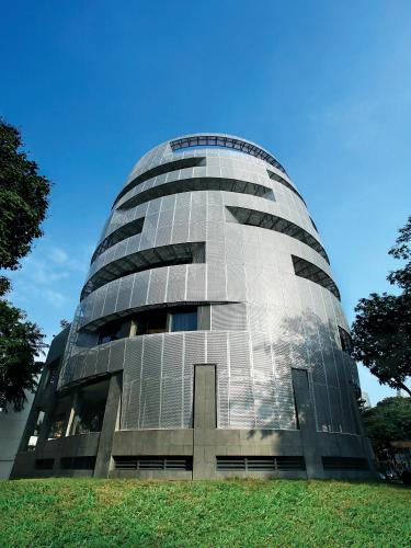 a glass building with a cross in front of it at D'Hotel Singapore managed by The Ascott Limited in Singapore