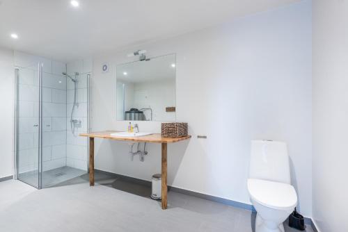 a bathroom with a sink and a toilet at Hattvika Lodge in Ballstad