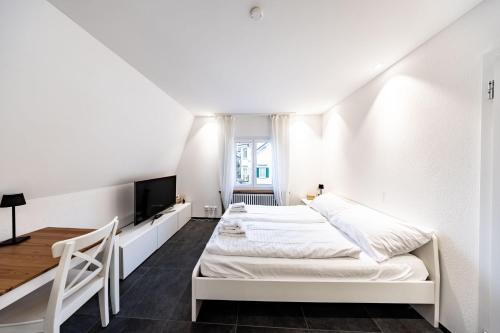 En eller flere senge i et værelse på Max Apartments