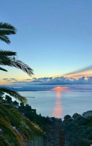 a view of the ocean with a sunset in the distance at Villa San Vito Amalfi Coast A timeless charm in Vietri sul Mare