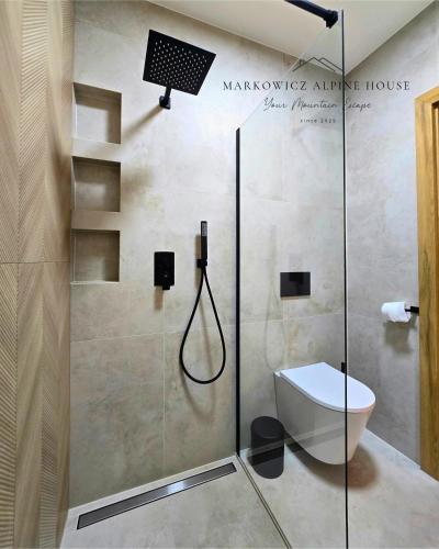 a bathroom with a shower and a toilet at Markowicz Alpine House in Szaflary