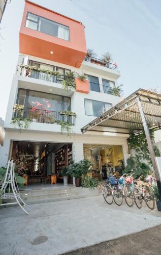 a building with bikes parked in front of it at Celia Boutique Hotel in Phong Nha