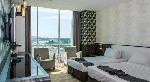 Giường trong phòng chung tại MH Hotels Ipoh