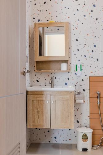 a bathroom with a sink and a mirror at Zana Villas in Krabi