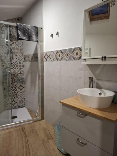 a bathroom with a sink and a shower at Monolocale Corbetta centro - House lab Milan in Corbetta