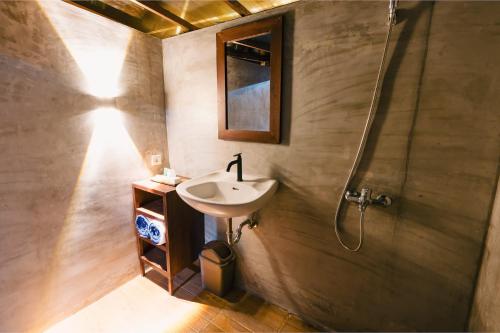 a bathroom with a sink and a shower at Viyana Ubud Villas in Ubud
