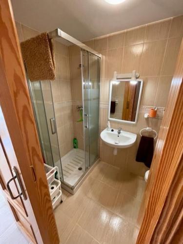 a bathroom with a shower and a sink at Apartamento en playa de Torrenostra in Torrenostra