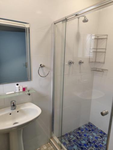 a bathroom with a shower and a sink at 899 On Burlington in Pretoria