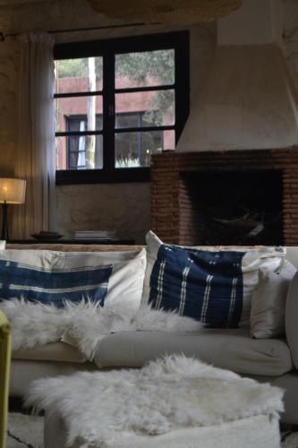 En eller flere senge i et værelse på Villa Quince