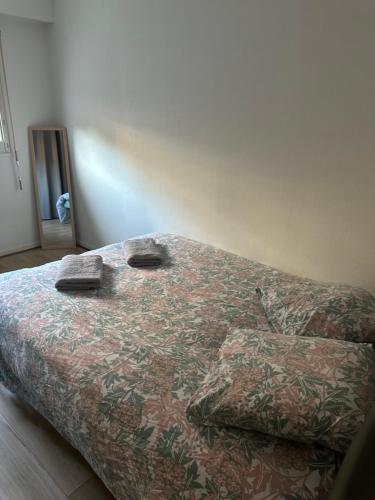 a bed with two pillows on it in a bedroom at ici ville d'histoire in Nevers