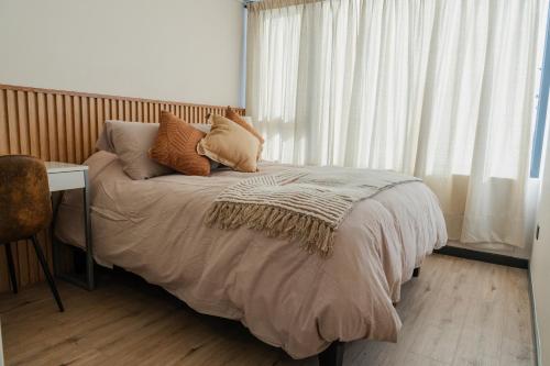 Giường trong phòng chung tại Elegancia Moderna en Altura