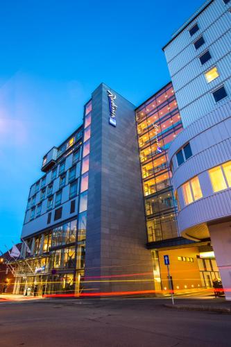 a tall building with a lot of windows at Radisson Blu Hotel Tromsø in Tromsø