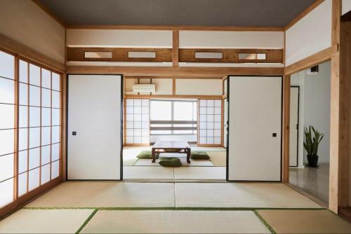 a japanese home with sliding glass doors at Yamatsu Tokyo House in Tokyo
