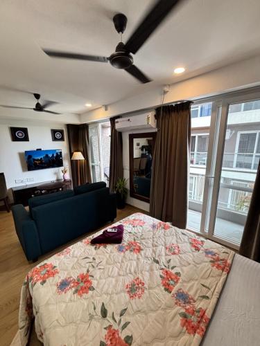 a bedroom with a bed and a couch at neon viman stays in Pune