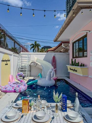 a pool with an inflatable elephant in the water at Home to my heart mare pool villa in Jomtien Beach
