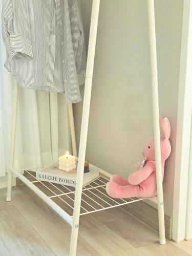 a toy crib with a teddy bear in a room at Soul House in Seoul