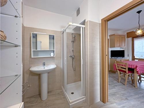 a bathroom with a shower and a sink at BBkey La cjase SOT LA STRETE in Arta Terme