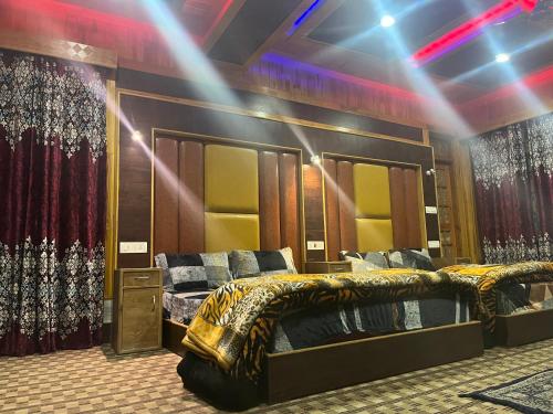 a room with a bed and some curtains at Hotel Apex in Srinagar
