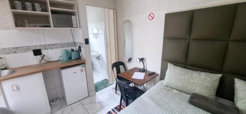 Kuchyň nebo kuchyňský kout v ubytování Talitha's Self Catering