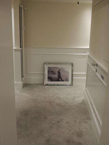 a picture frame sitting on the floor in a room at Suite Milano Duomo in Milan