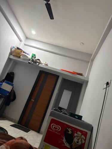 a room with a room with a door and a ceiling at Hotel Sarkar in Indore