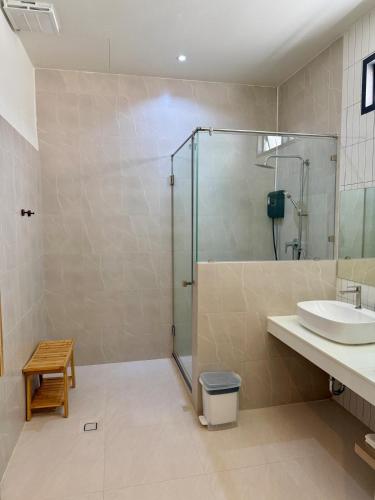 a bathroom with a shower and a sink at Booze room in Ban Khlong Chi Lat