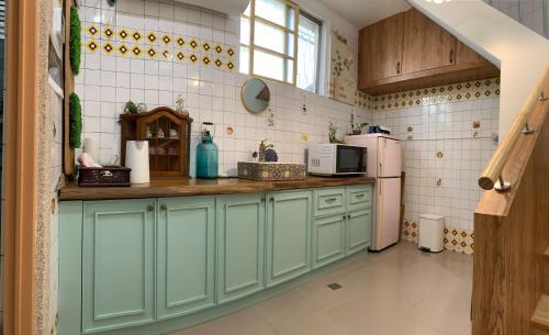 Køkken eller tekøkken på 沐時光民宿