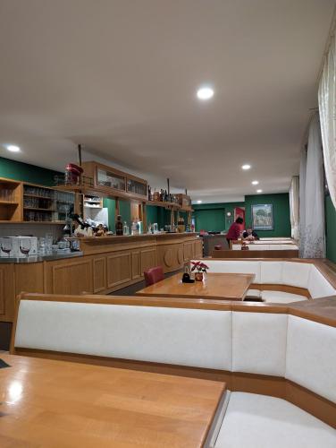 a large kitchen with a large island in a room at Hotel Shiva in Maingründel