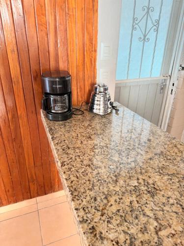 a kitchen counter with a coffee maker on top of it at Casa en Cuernavaca Morelos in Cuernavaca