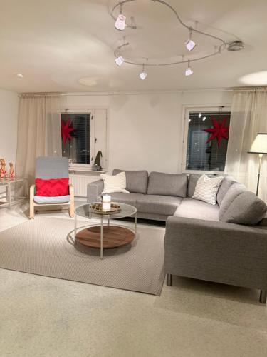 a living room with a couch and a table at Nietos Aurora in Ylitornio