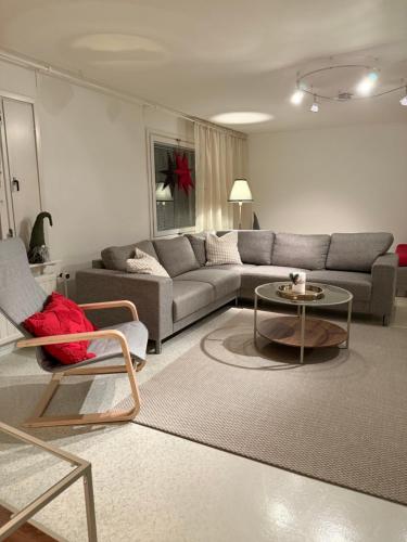 a living room with a couch and a table at Nietos Aurora in Ylitornio