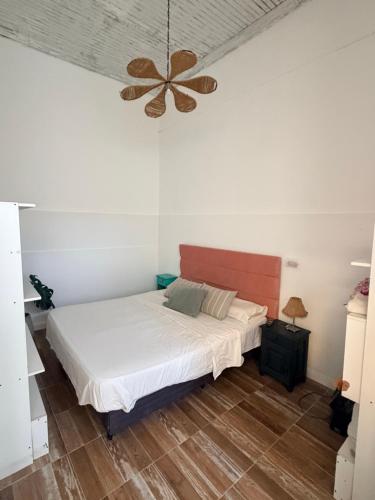 a bedroom with a bed and a ceiling fan at Terminal Depto in Azul