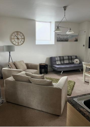 a living room with a couch and a table at Beautiful Countryside Cottage Alnwick Northumberland in Alnwick