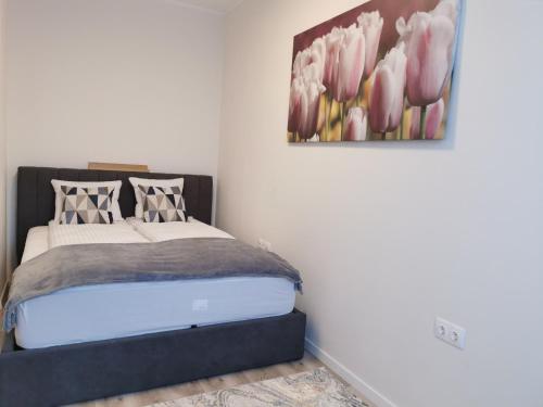 En eller flere senge i et værelse på River Apartman 1